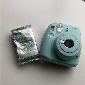 polaroid camera and one pack of film